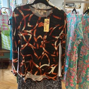 Long sleeve printed knit top.Easy to pair with black pants or jeans, size small.